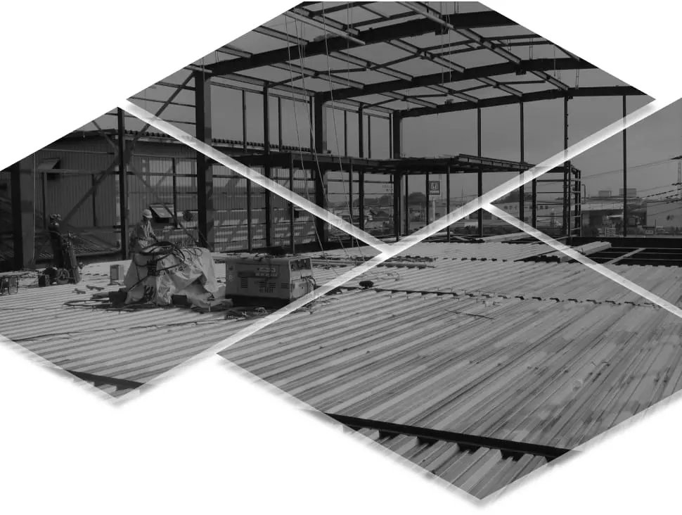 建設現場で、鉄骨構造の建物の骨組みが組み立てられている様子